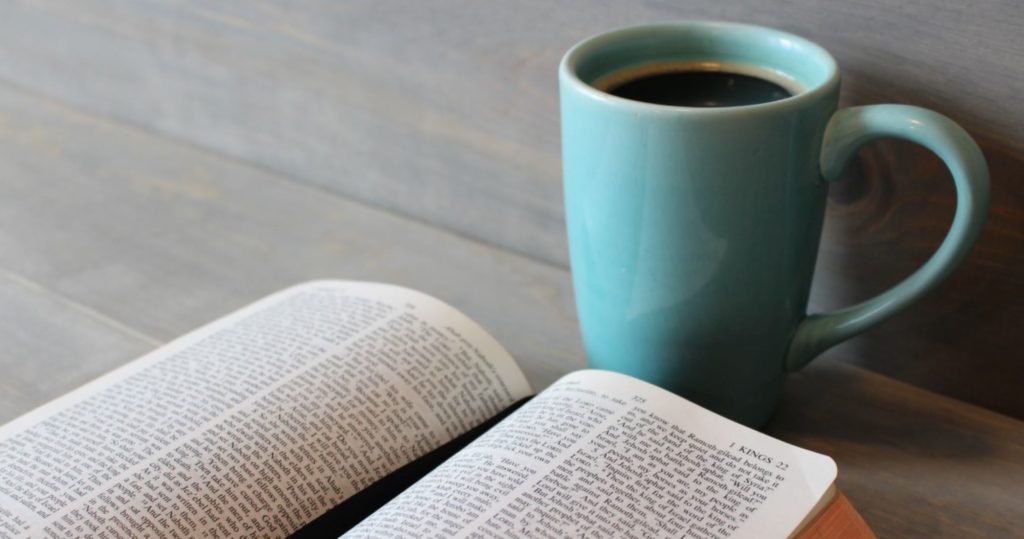 A Bible and a coffee cup